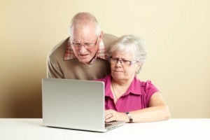 Senior couple laptop confused