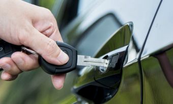 Individual unlocking car with keys