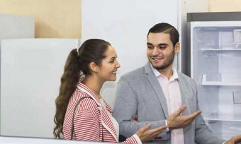 Couple looking at fridge