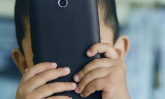 Child playing with phone