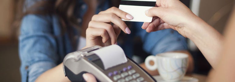 Women making payment using credit card