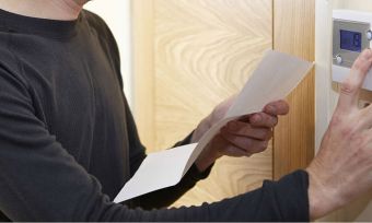 Man clicking button with paper