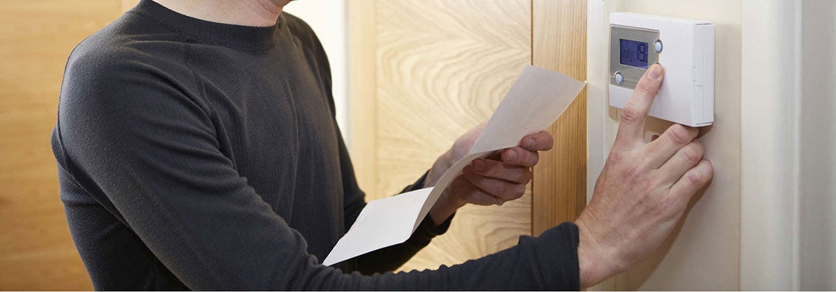 Man clicking button with paper