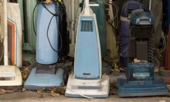 Old Vacuum Cleaners Lined Up in a row