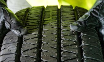 tyre being held with gloves