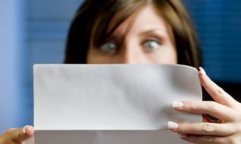 Women looking at paper worried