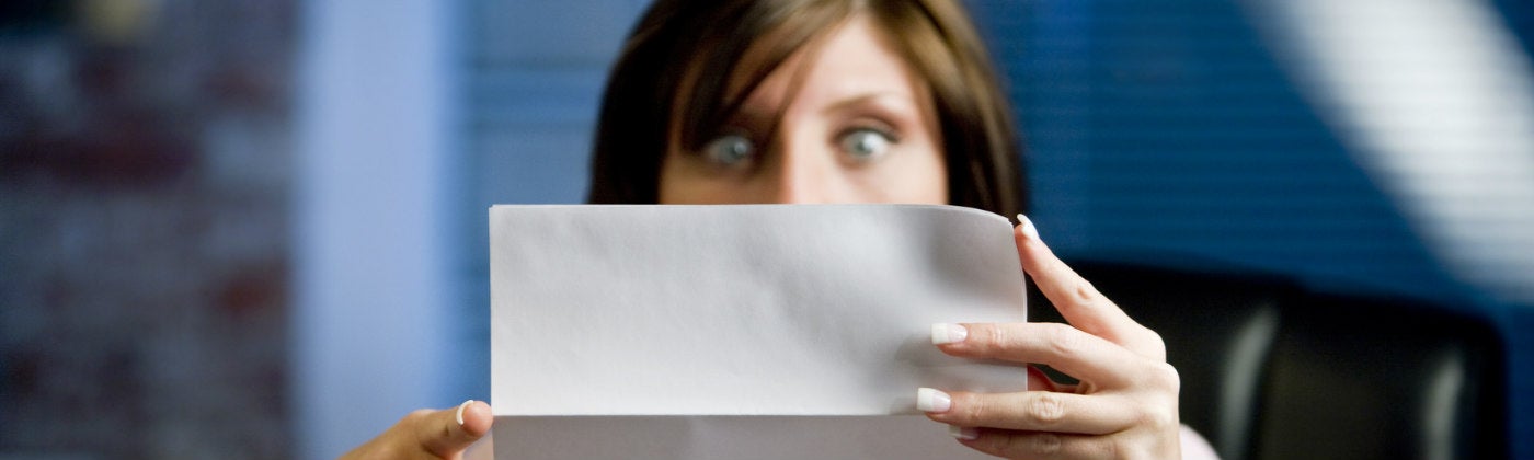 Women looking at paper worried