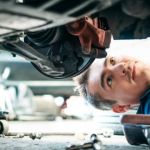 mechanic under car