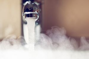 tap dispensing hot water with steam
