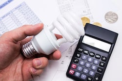 Light bulb with calculator and coins