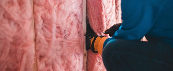 Man installing insulation