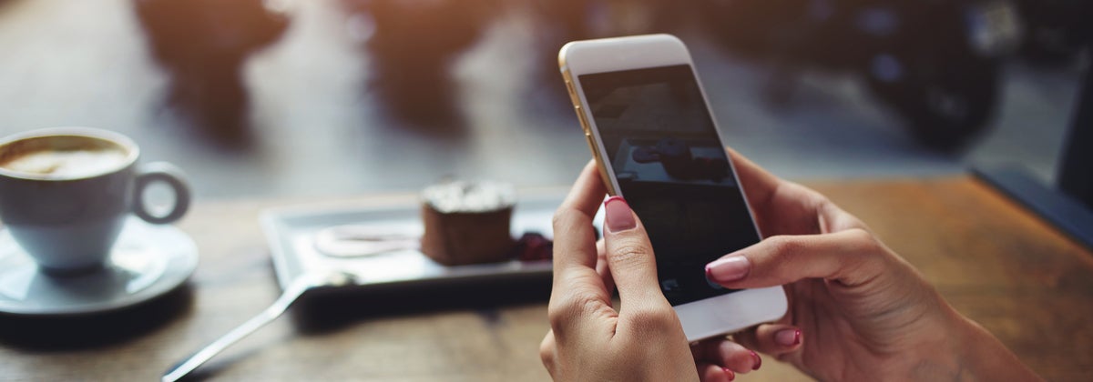 woman holding smartphone