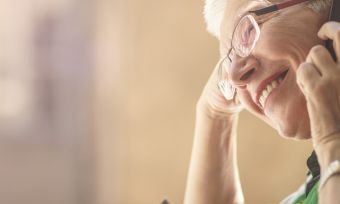 smiling senior on phone