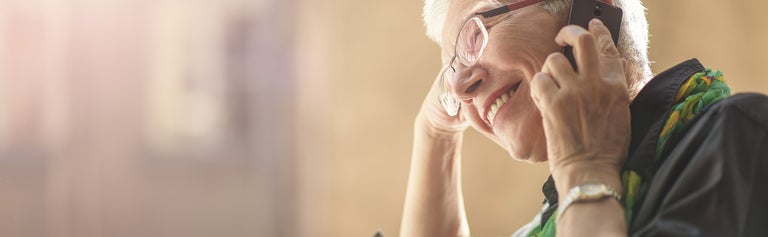 smiling senior on phone