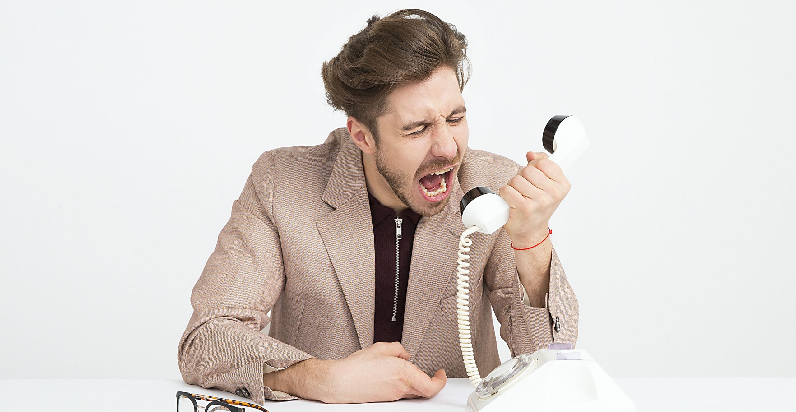 electricity providers customer service man yelling into phone