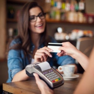 Woman paying coffee